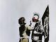 Banksy: O Artista Anônimo que Transformou a Arte de Rua em Fenômeno Global